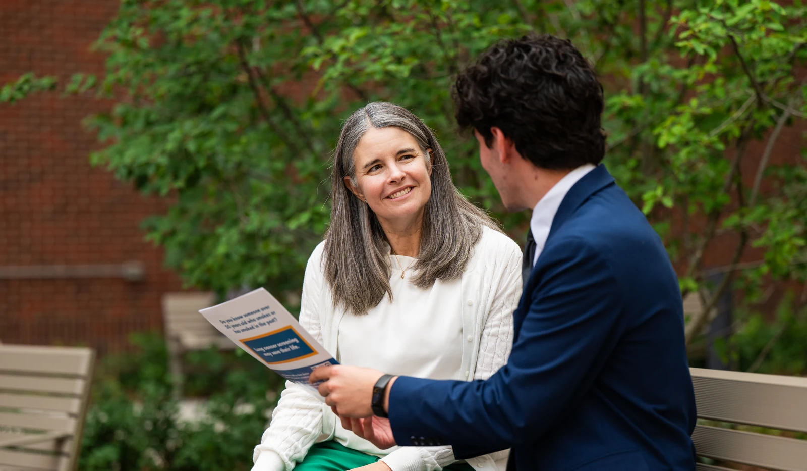 An ALCSI advocate discusses lung cancer screening with a community member